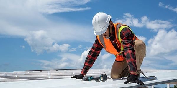 roofer-working-in-protective-work-wear-gloves-cons-2023-11-27-05-17-50-utc.jpg